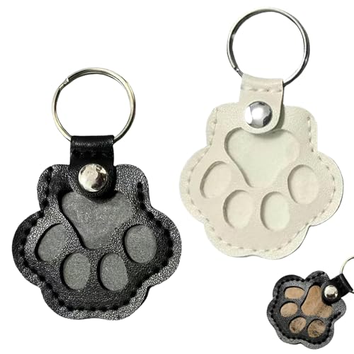 KLINNA 2pcs Schlüsselanhänger für Tierhaare, Leder Anhänger zur Tierhaar-Aufbewahrung als Haustier-Memory Erinnerungsbox, Hundehaar-Sammler in Pfote Design mit Druckknopf (Weiß+Schwarz) von KLINNA